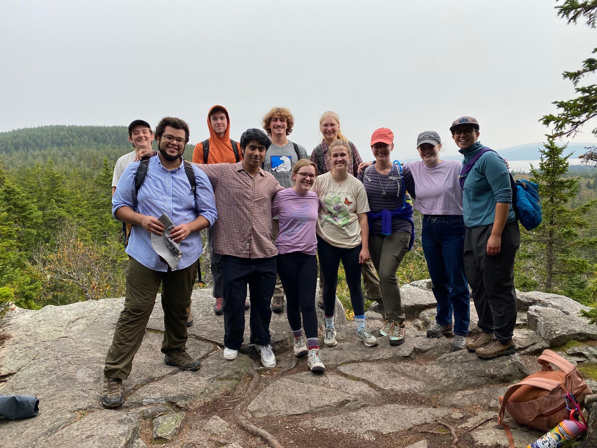 Students and faculty stop for a photo on their hike on the Schoodic Head Trail