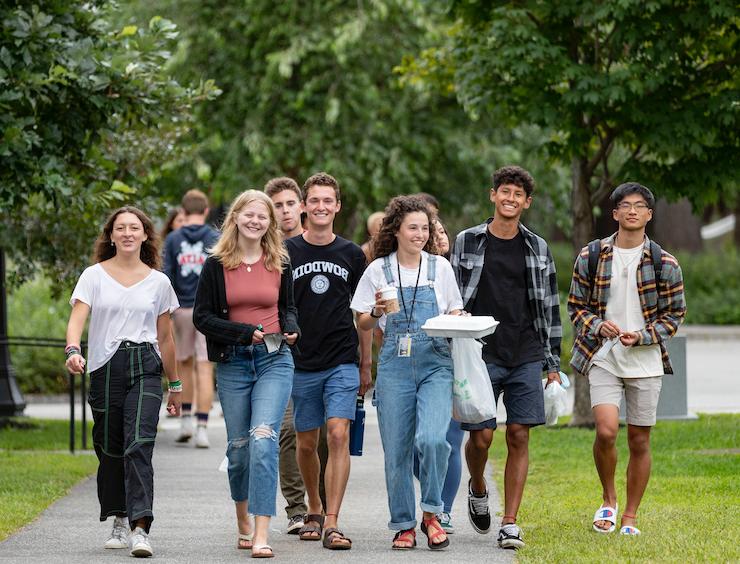 New students at Bowdoin walk back from the dining hall.