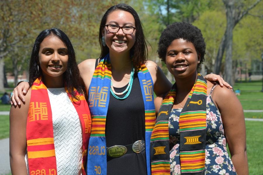 Three students posing at Commencement